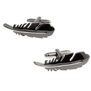 Two feather-shaped cufflinks, silver and black, on a white background