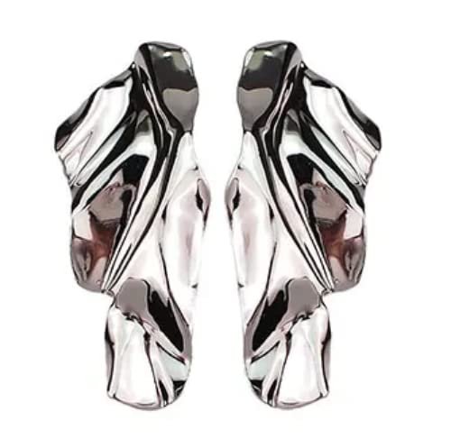 Two abstract, silver-colored earrings with a flowing, organic design