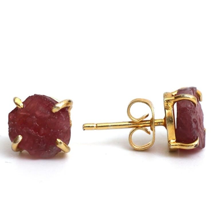 Gold stud earrings with raw, red gemstone settings