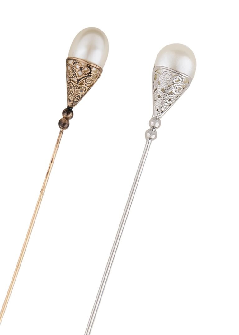 Two decorative hair pins with pearl-like tops and filigree details