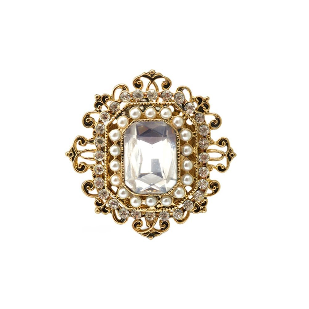 Gold brooch with a large clear gem, pearls, and small crystals