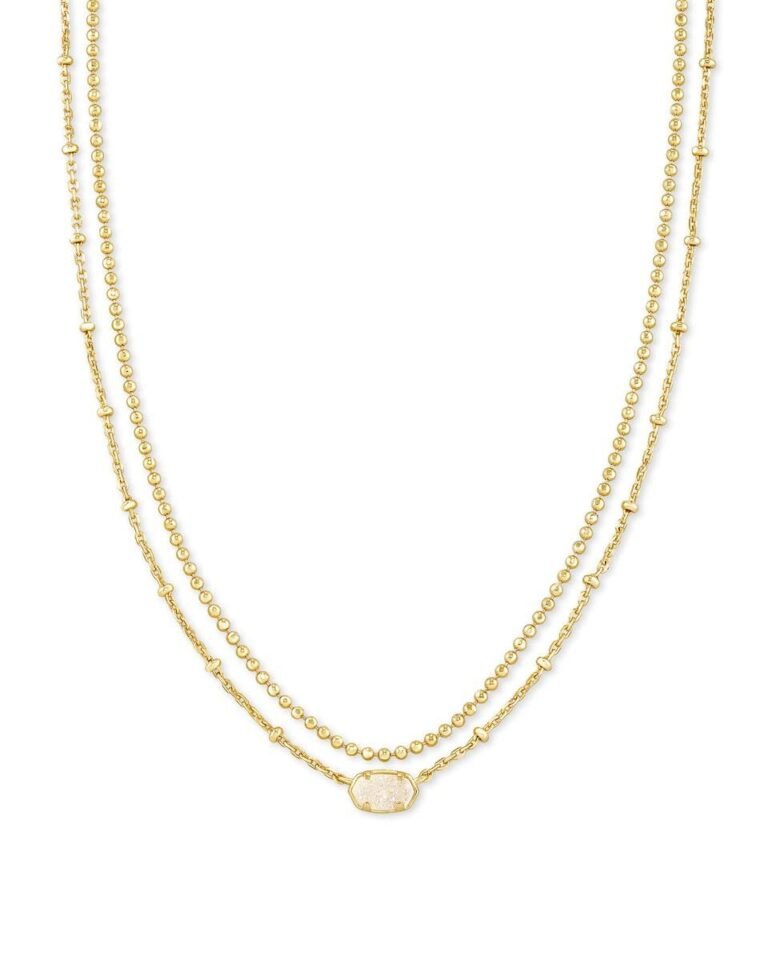Gold layered necklace with a small, oval, white stone pendant