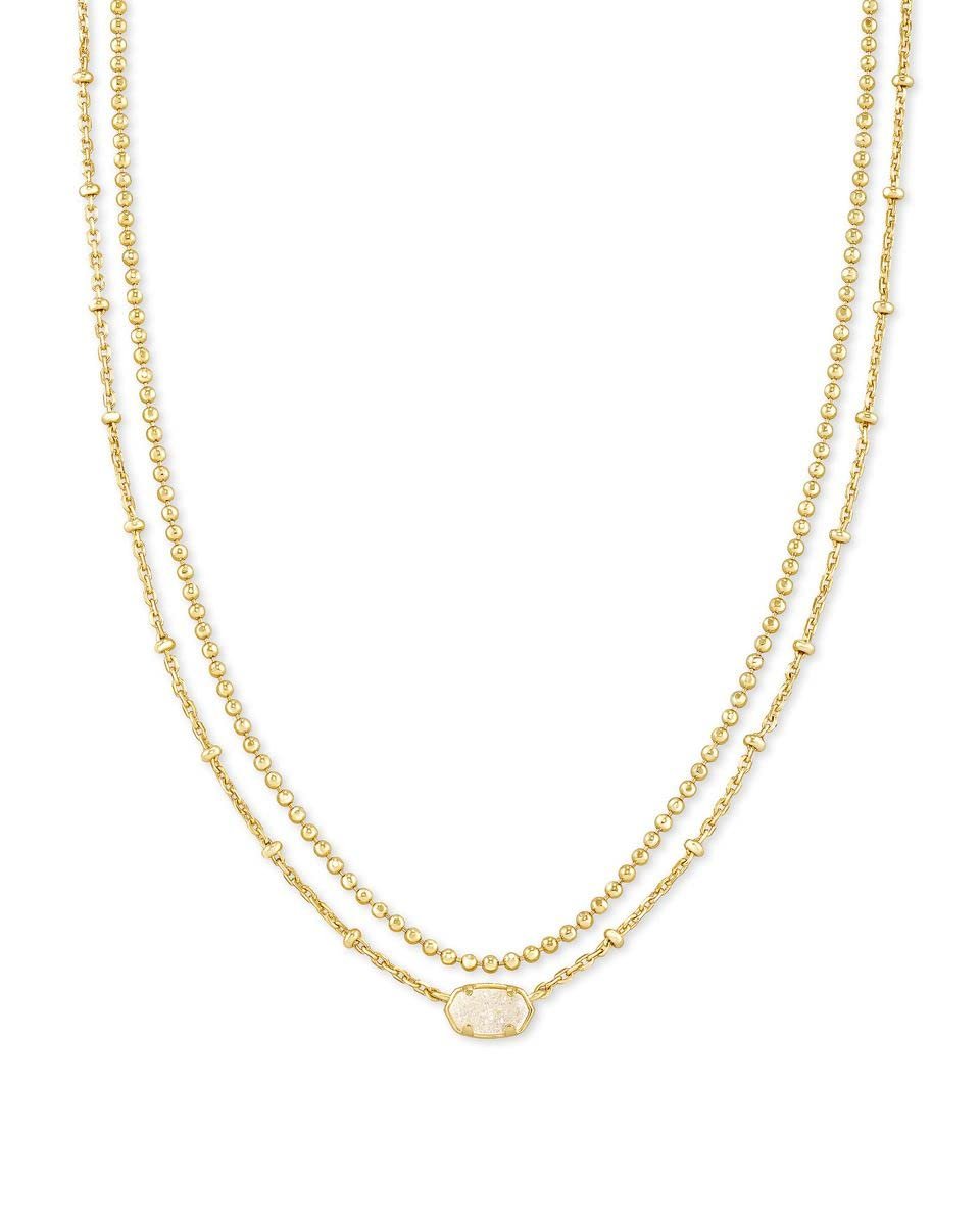Gold layered necklace with a small, oval, white stone pendant