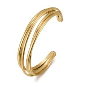 Gold cuff bracelet with three curved bands, isolated on white background