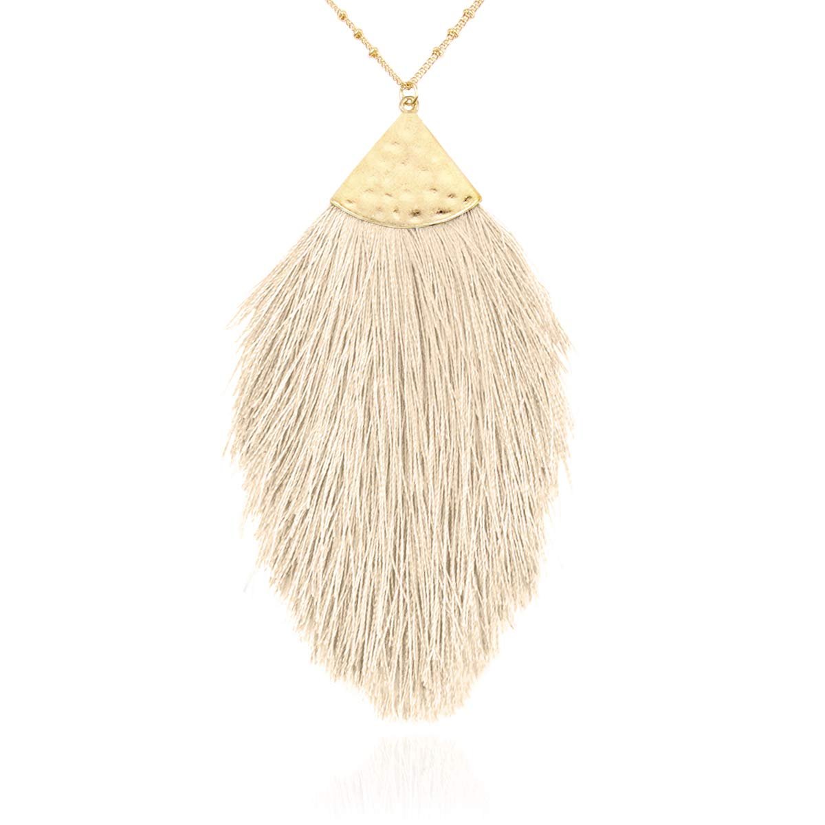 Gold necklace with a cream-colored tassel pendant on a white background