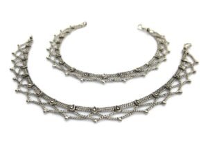 Two silver anklets with intricate, delicate chain and bead design