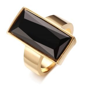 Gold ring with a large, rectangular black gemstone