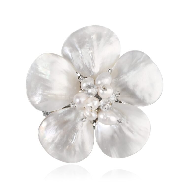 Flower-shaped brooch with large mother-of-pearl petals and pearl center