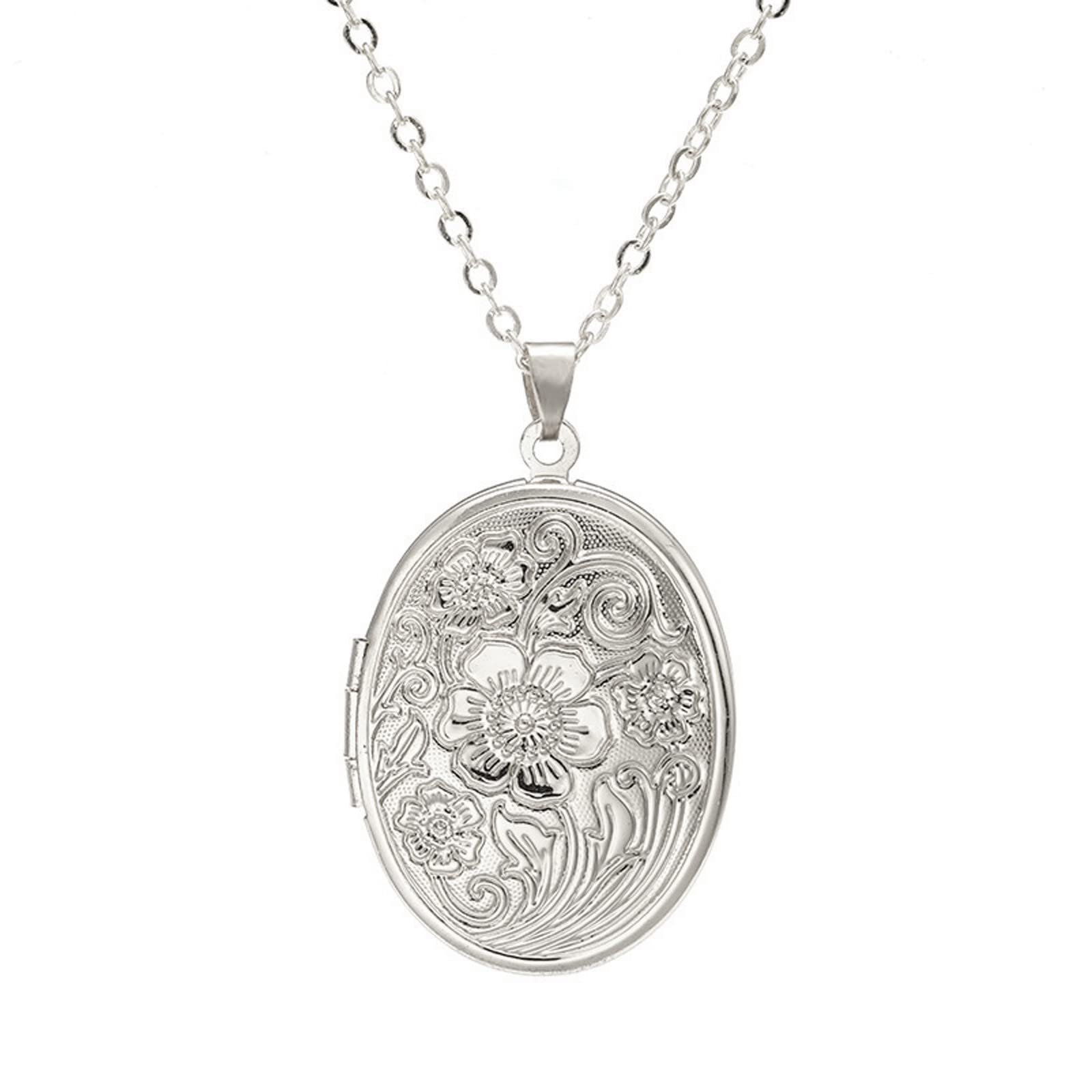 Silver oval locket necklace with floral design and chain