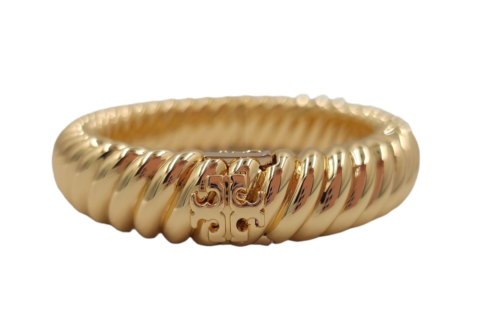 Gold-colored, ridged bracelet with a logo clasp on a white background