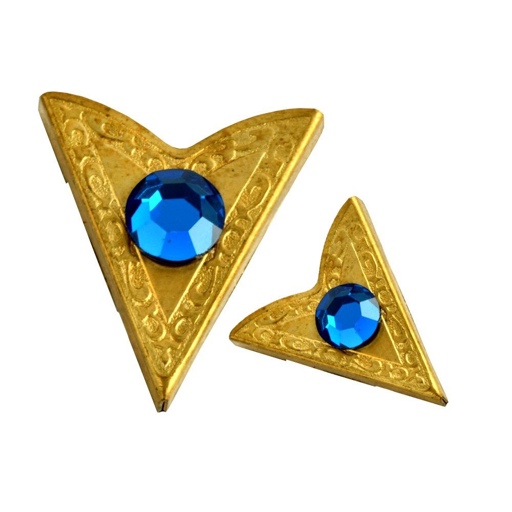 Two gold triangle brooches with blue gemstones on a white background