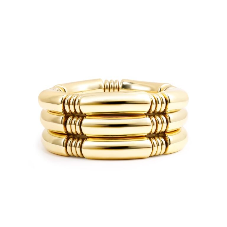 Gold, stacked bracelet with three rows of rounded, segmented links