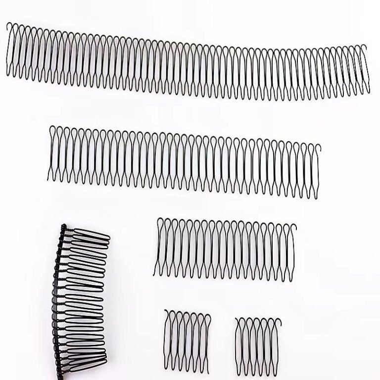 Several black hair combs of different sizes on a white background