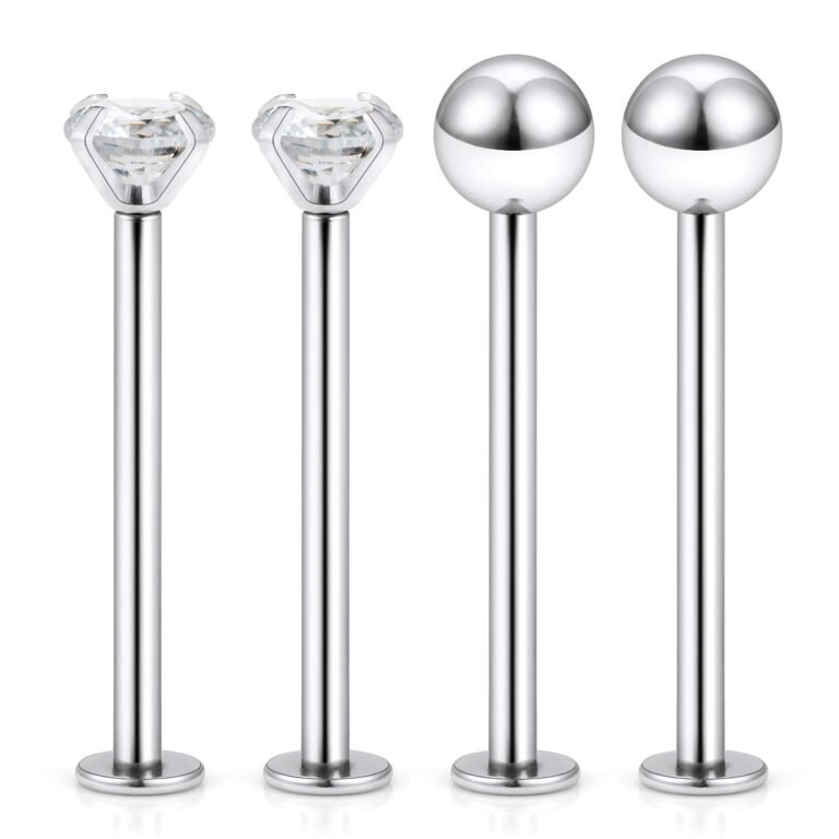 Four silver labret studs, two with diamonds, two with balls