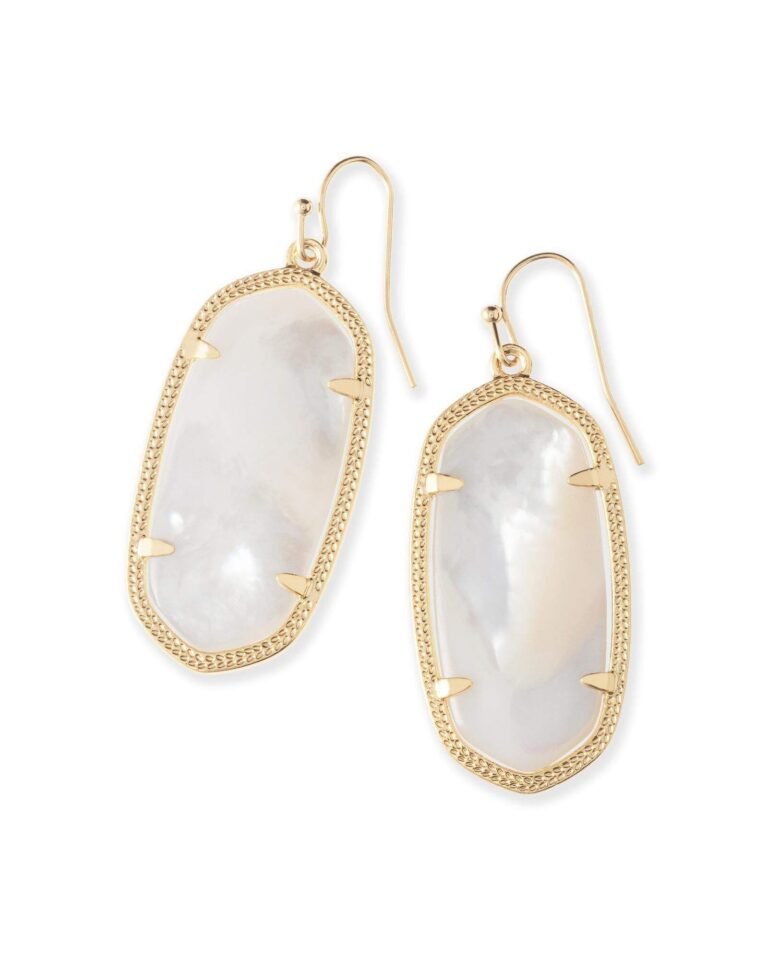 Gold earrings with white oval stones and textured gold trim