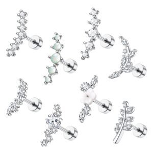 Seven different silver ear piercing studs with various gemstone designs