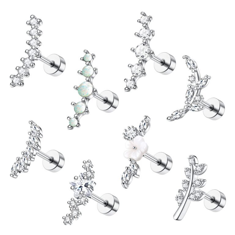 Seven different silver ear piercing studs with various gemstone designs