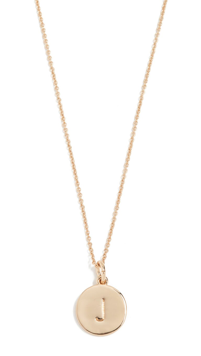 Gold necklace with a circular pendant featuring the letter "J"