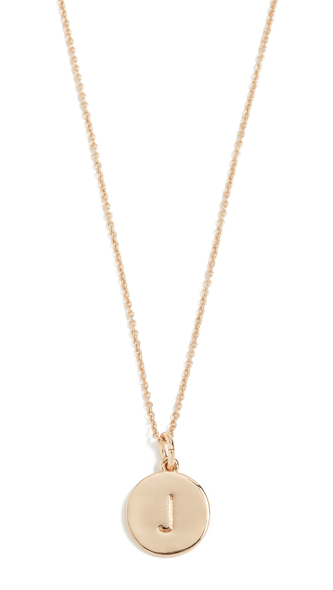 Gold necklace with a circular pendant featuring the letter "J"