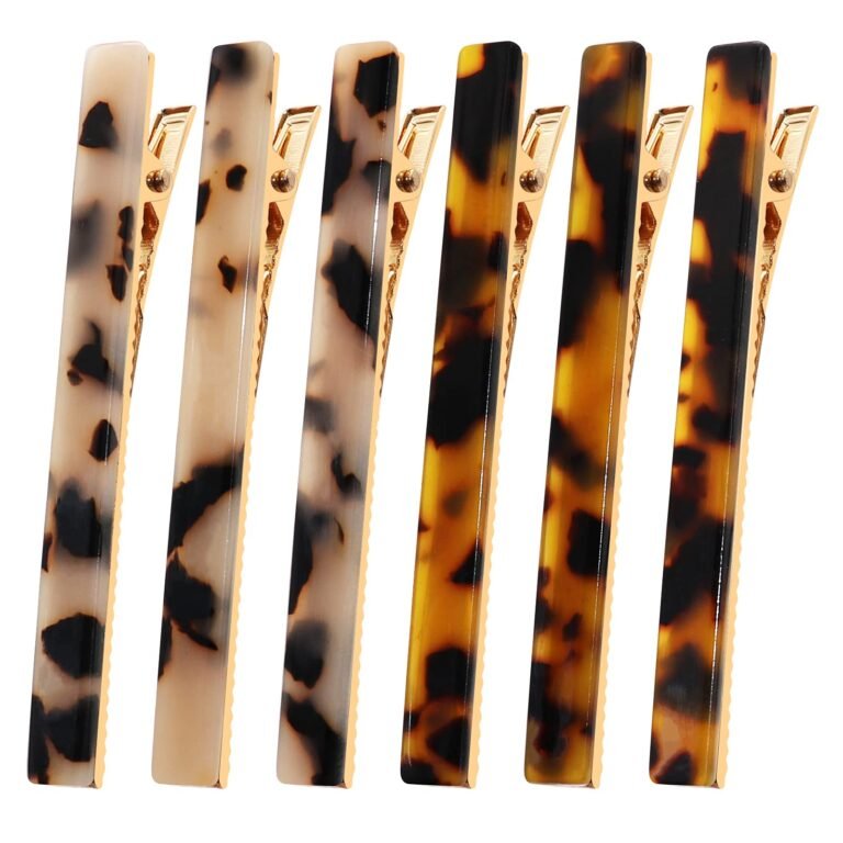 Six tortoise shell hair clips with gold-colored metal accents
