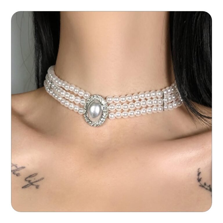 Pearl choker necklace with a large oval pendant on a woman's neck