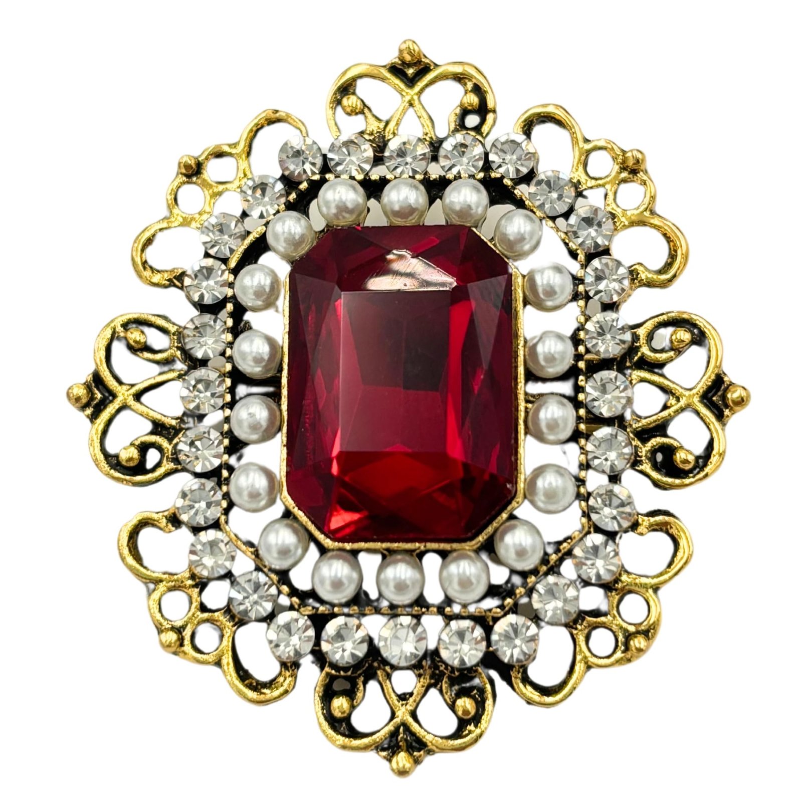 Ornate gold brooch with a large red gem, pearls, and diamonds