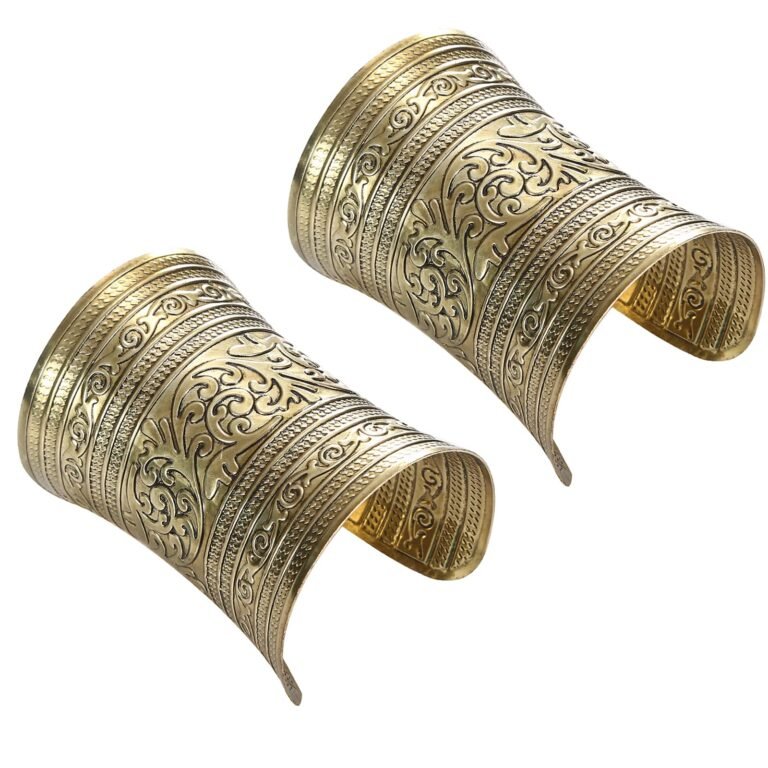Two ornate gold arm cuffs with detailed floral and geometric patterns