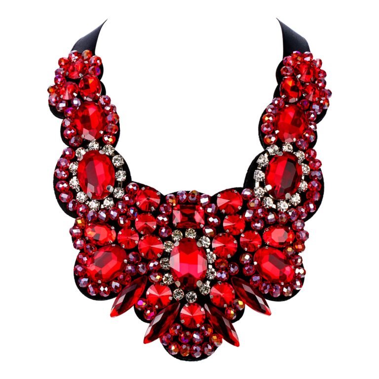 Red jeweled statement necklace with black backing, isolated on white background