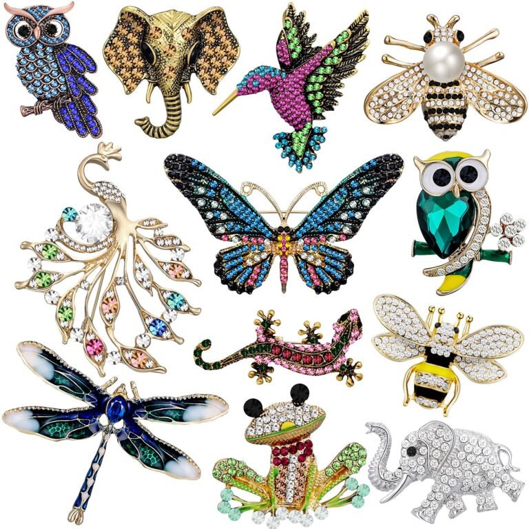 Jeweled animal brooches including an owl, elephant, butterfly, and hummingbird